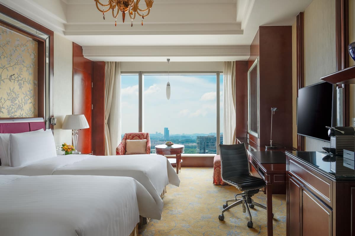 Premium bedding, down duvets, free minibar items, in-room safe