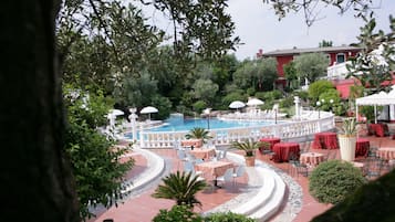 Seasonal outdoor pool, open 9:00 AM to 7:00 PM, pool umbrellas