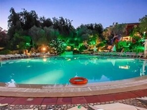 Seasonal outdoor pool, open 9:00 AM to 7:00 PM, pool umbrellas