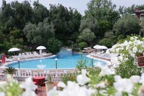 Seasonal outdoor pool, open 9:00 AM to 7:00 PM, pool umbrellas