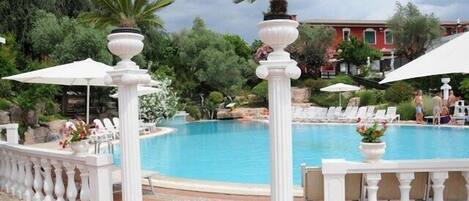 Seasonal outdoor pool, pool umbrellas, pool loungers