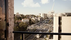 A cityscape with modern buildings, a prominent tower, and a clear sky. - Skyline Hotel Jerusalem (Jerusalem)