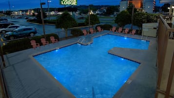 Relax by the pool at Vacation Lodge, where guests can enjoy a refreshing swim.