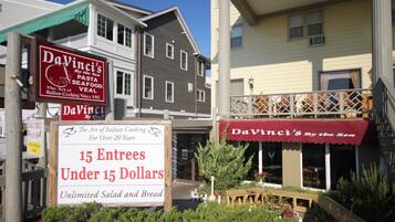 A restaurant named DaVinci's by the sea with a sign offering 15 entrees under $15.