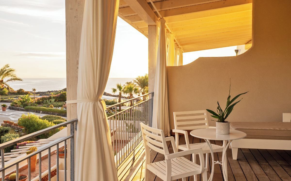 Premier Triple Room, Terrace, Partial Sea View | Minibar, in-room safe, desk, soundproofing