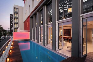 Outdoor pool, open 6:00 AM to 9:00 PM, pool loungers