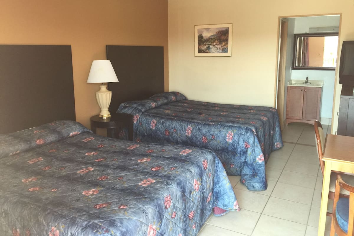 Standard Room, 2 Queen Beds, Non Smoking, Pool View | 1 bedroom, desk, blackout drapes, iron/ironing board