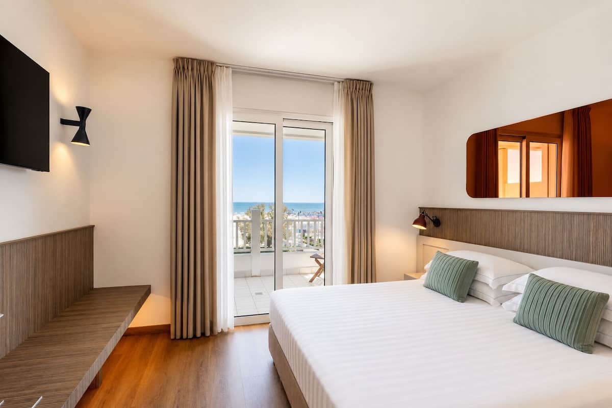 Suite, Balcony, Sea View | Down comforters, minibar, in-room safe, desk