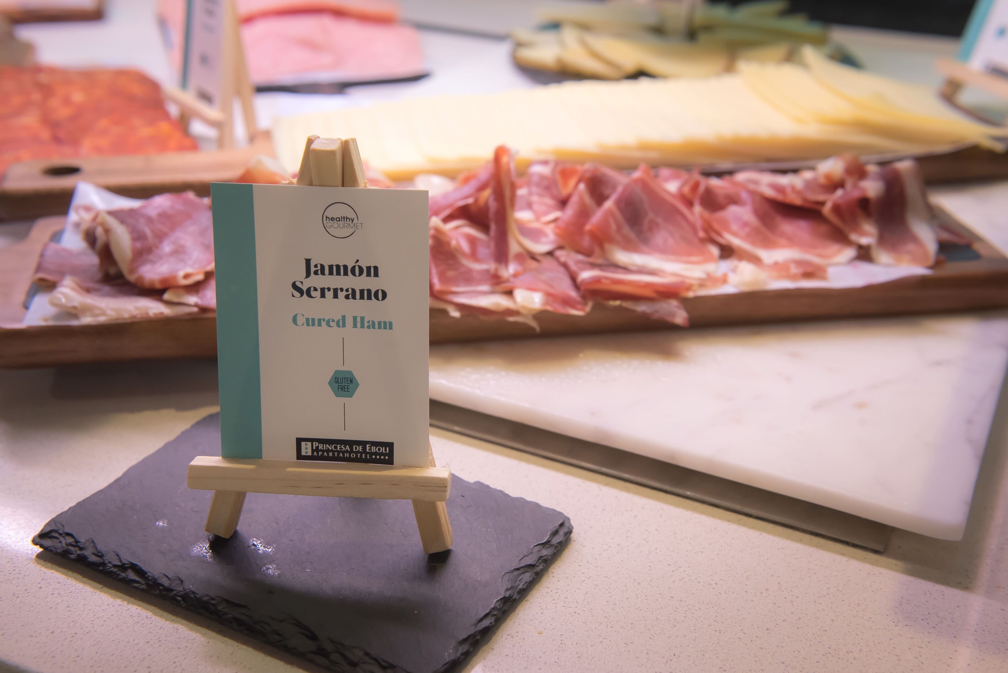 A display of cured ham at a hotel buffet.