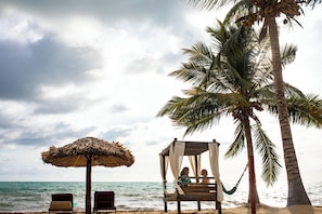 On the beach, sun loungers, beach umbrellas, beach towels - Belizean Dreams Resort (Hopkins)