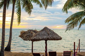 On the beach, sun loungers, beach umbrellas, beach towels - Belizean Dreams Resort (Hopkins)