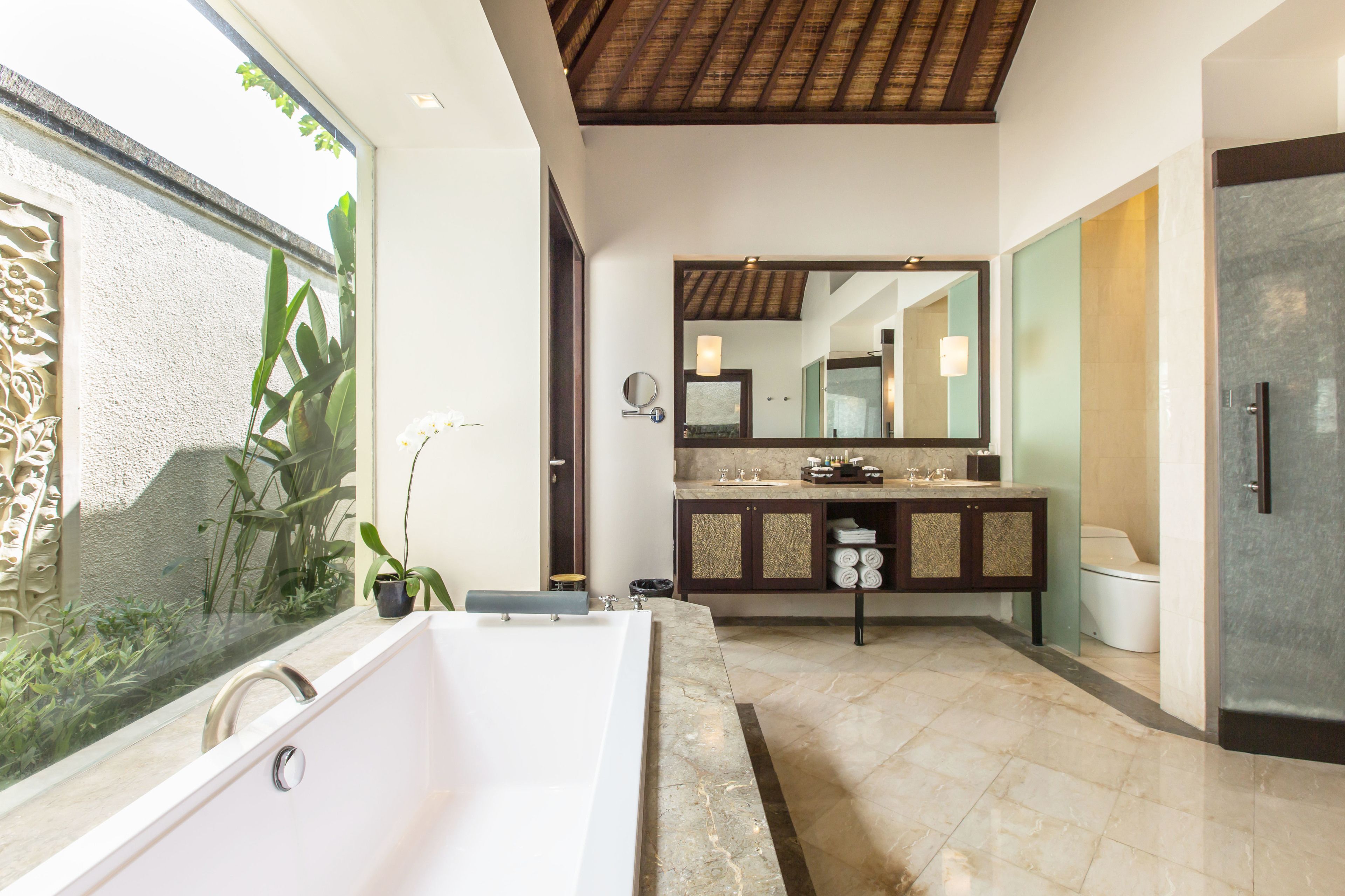 separate bathtub and shower, rainfall showerhead, designer toiletries