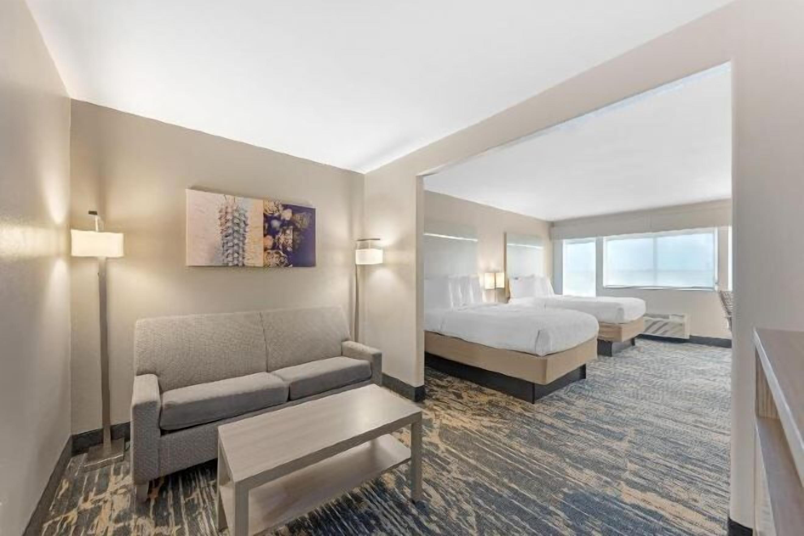 Down comforters, pillowtop beds, desk, laptop workspace