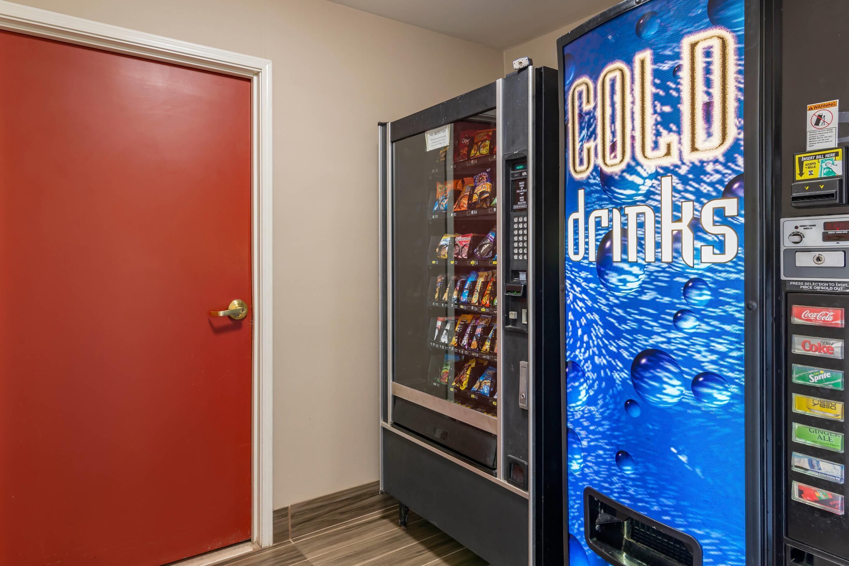 A vending machine labeled 'COLD DRINKS' with various beverage options.