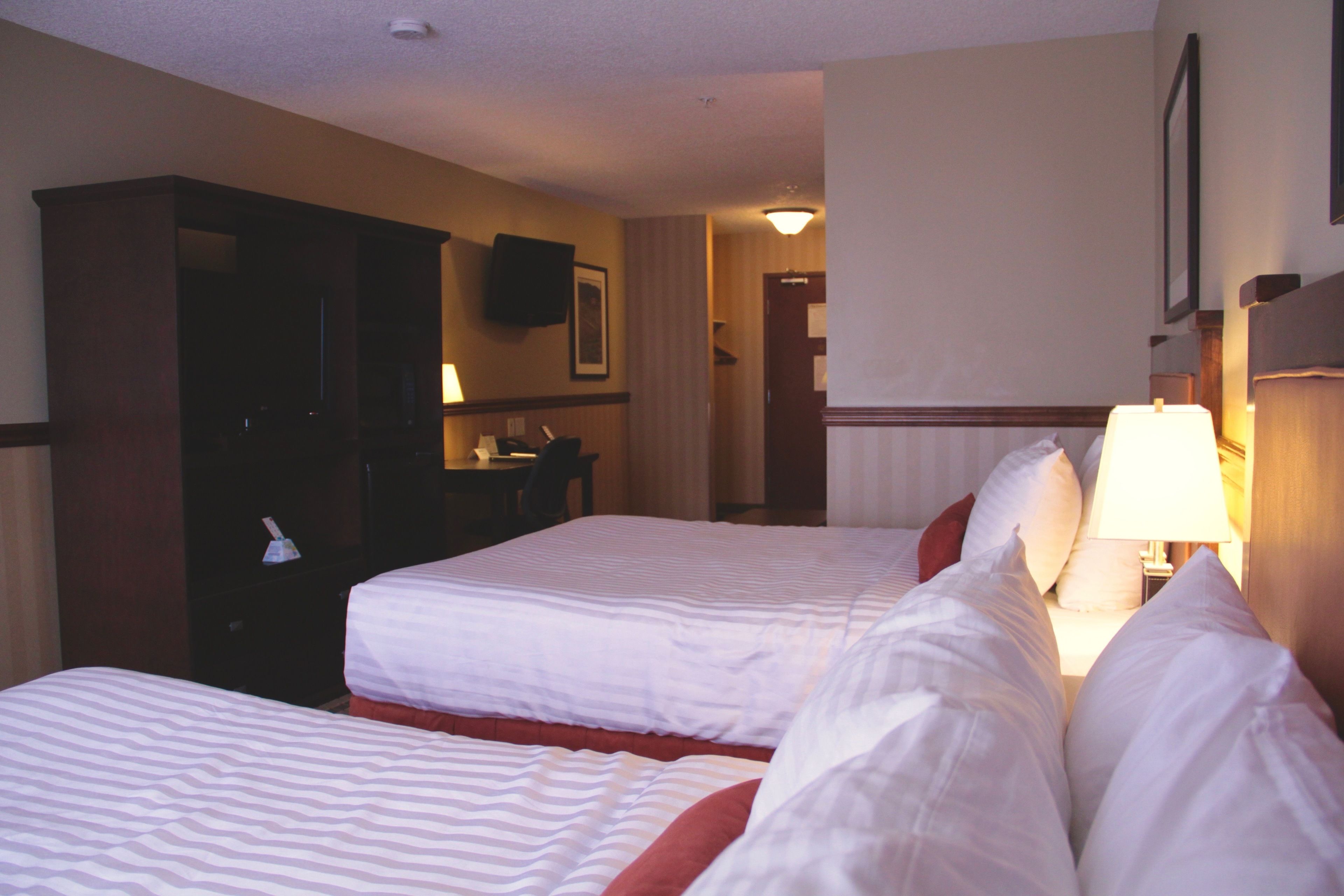 standard room, 2 queen beds, non smoking, microwave | in-room safe, individually decorated, individually furnished, desk