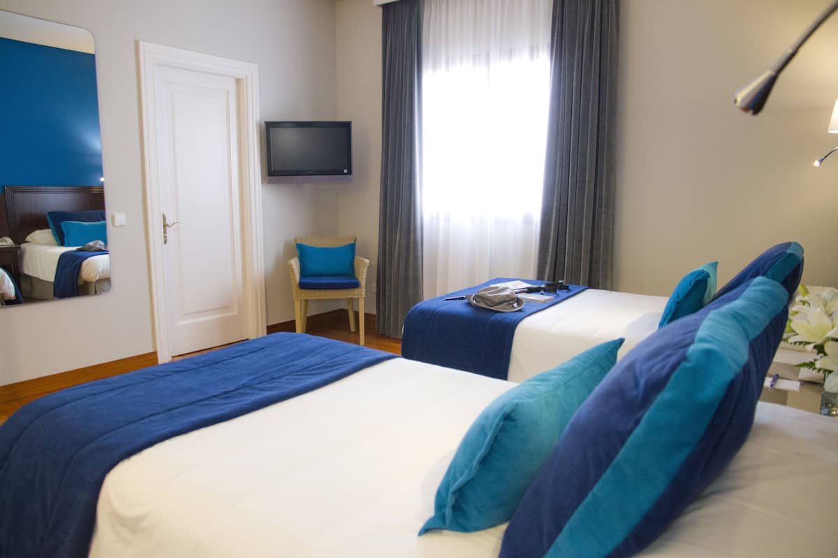 Camera con letto matrimoniale o 2 letti singoli, terrazzo | Una cassaforte in camera, una scrivania, Wi-Fi gratuito