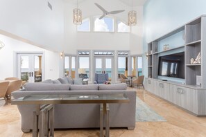 5 bedroom oceanfront Estate | Living area | 42-inch plasma TV with cable channels, TV, DVD player - The Somerset on Grace Bay (Providenciales)