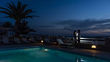 Seasonal outdoor pool, pool umbrellas, pool loungers
