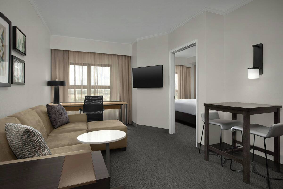 Premium bedding, desk, laptop workspace, iron/ironing board