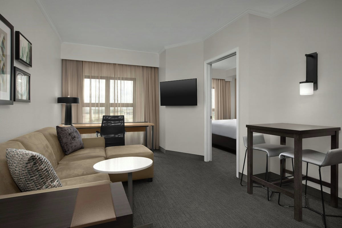 Premium bedding, desk, laptop workspace, iron/ironing board