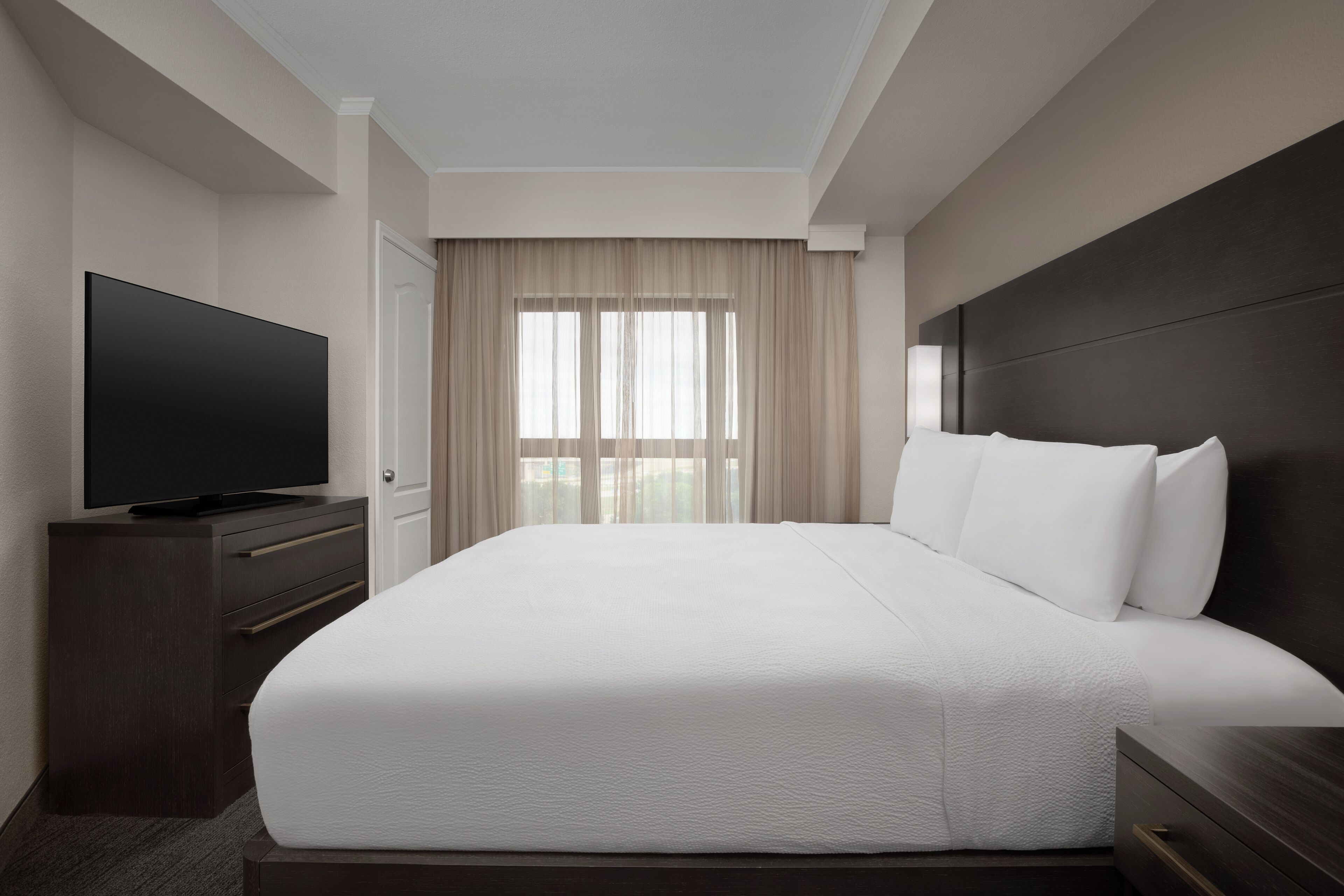 Premium bedding, desk, laptop workspace, iron/ironing board