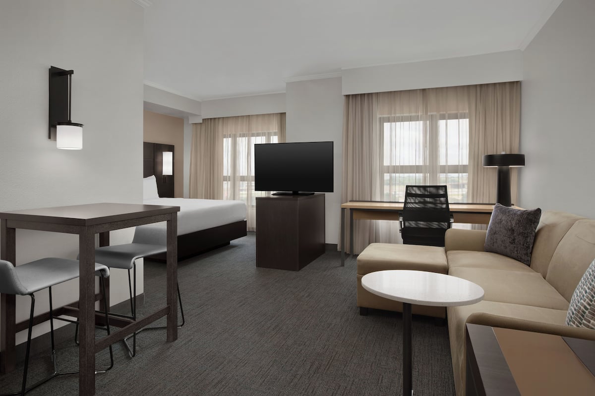 Premium bedding, desk, laptop workspace, iron/ironing board