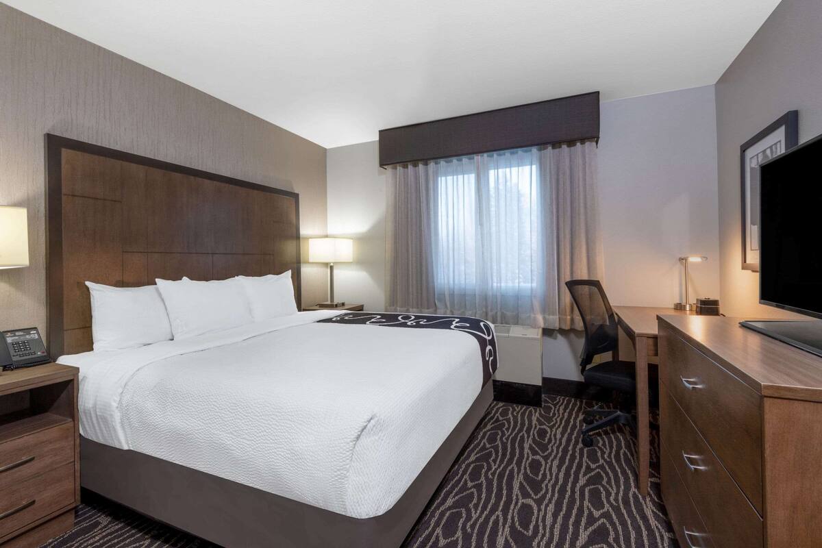 premium bedding, pillow-top beds, desk, laptop workspace