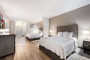 Deluxe Room, 2 Queen Beds (Smoke Free) | Desk, laptop workspace, blackout drapes, iron/ironing board