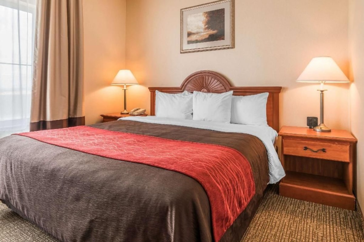 Premium bedding, desk, laptop workspace, iron/ironing board