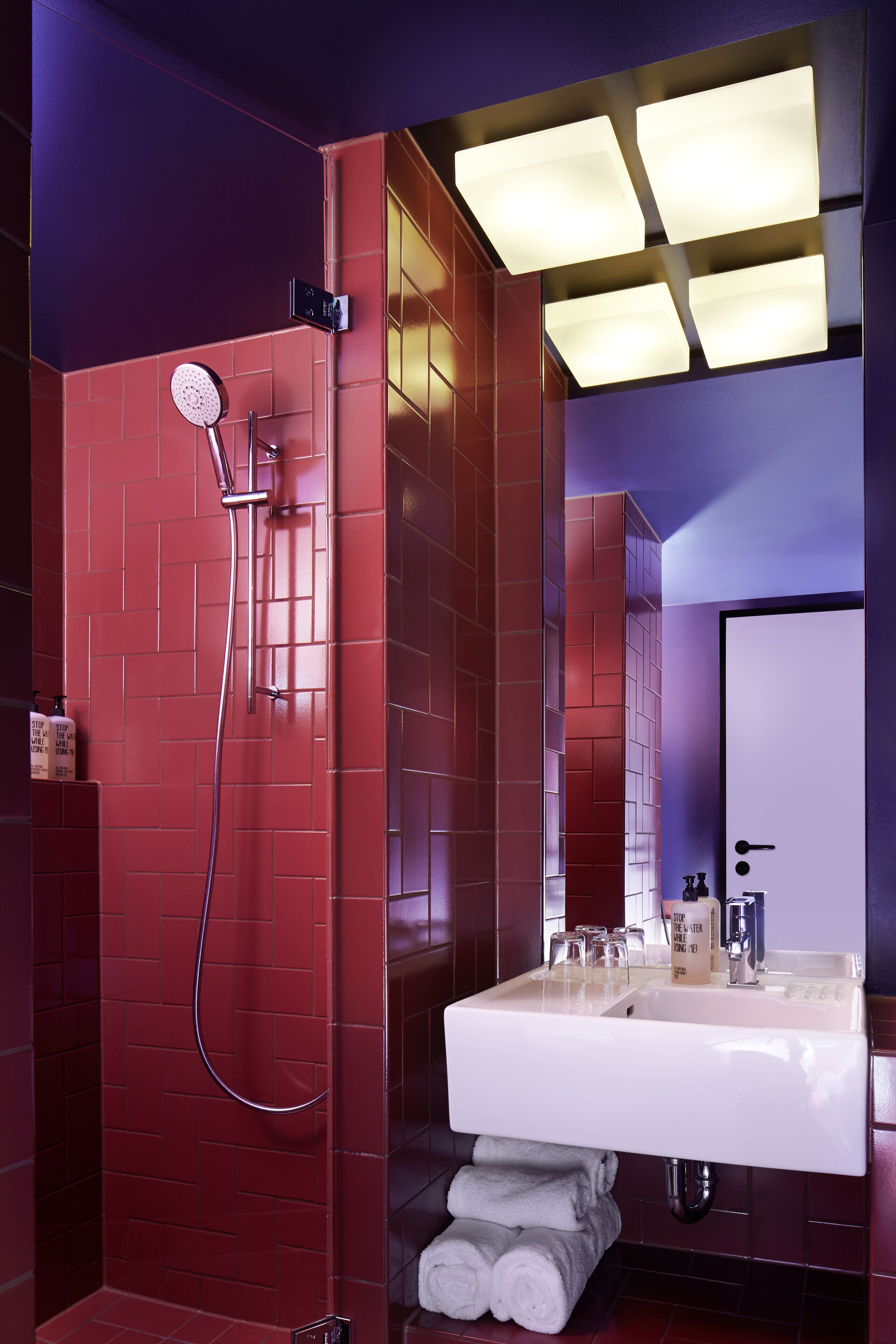 medium east | bathroom | shower, rainfall showerhead, designer toiletries, hair dryer