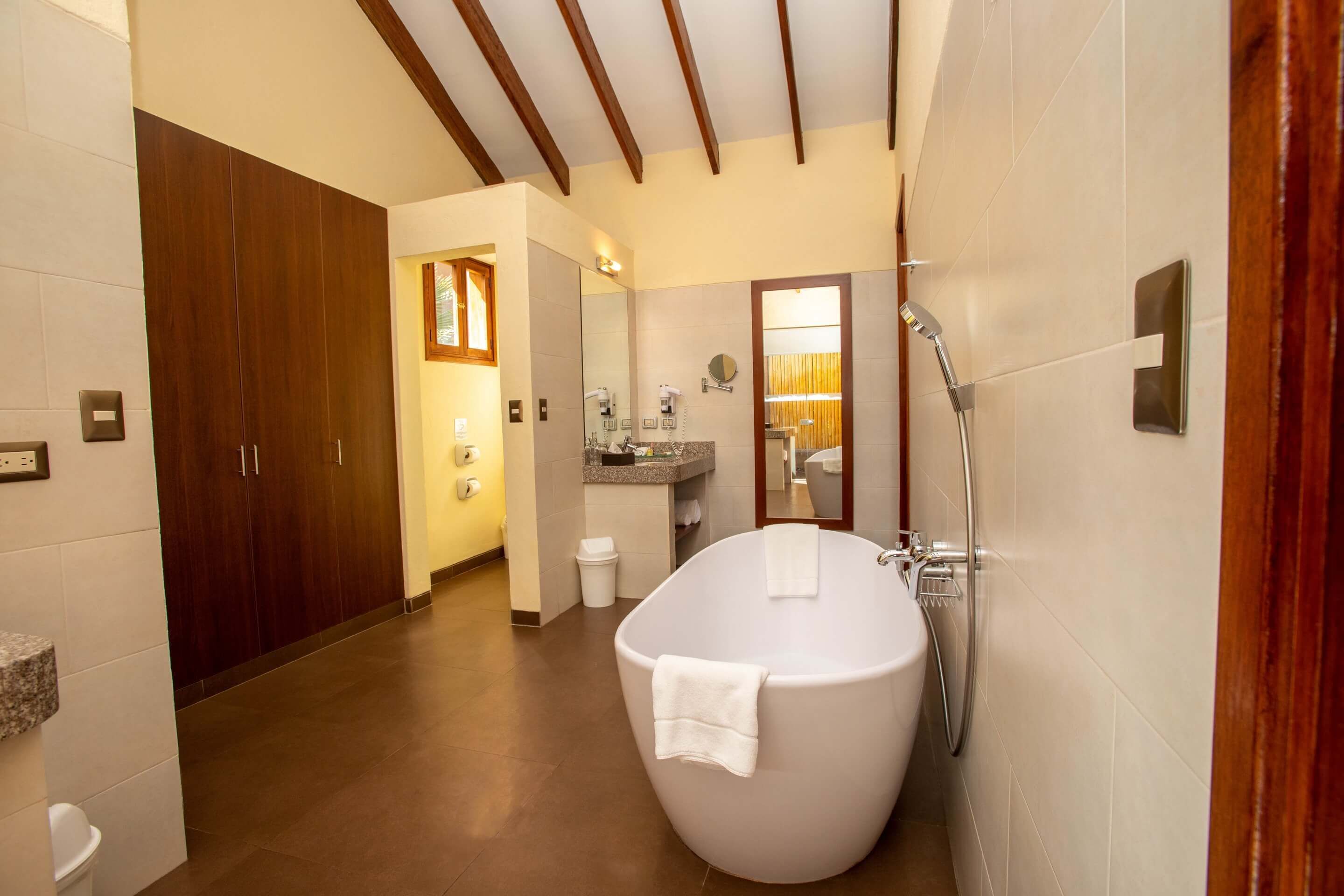 superior villa, 1 king bed | bathroom | combined shower/bathtub, free toiletries, hair dryer, bathrobes