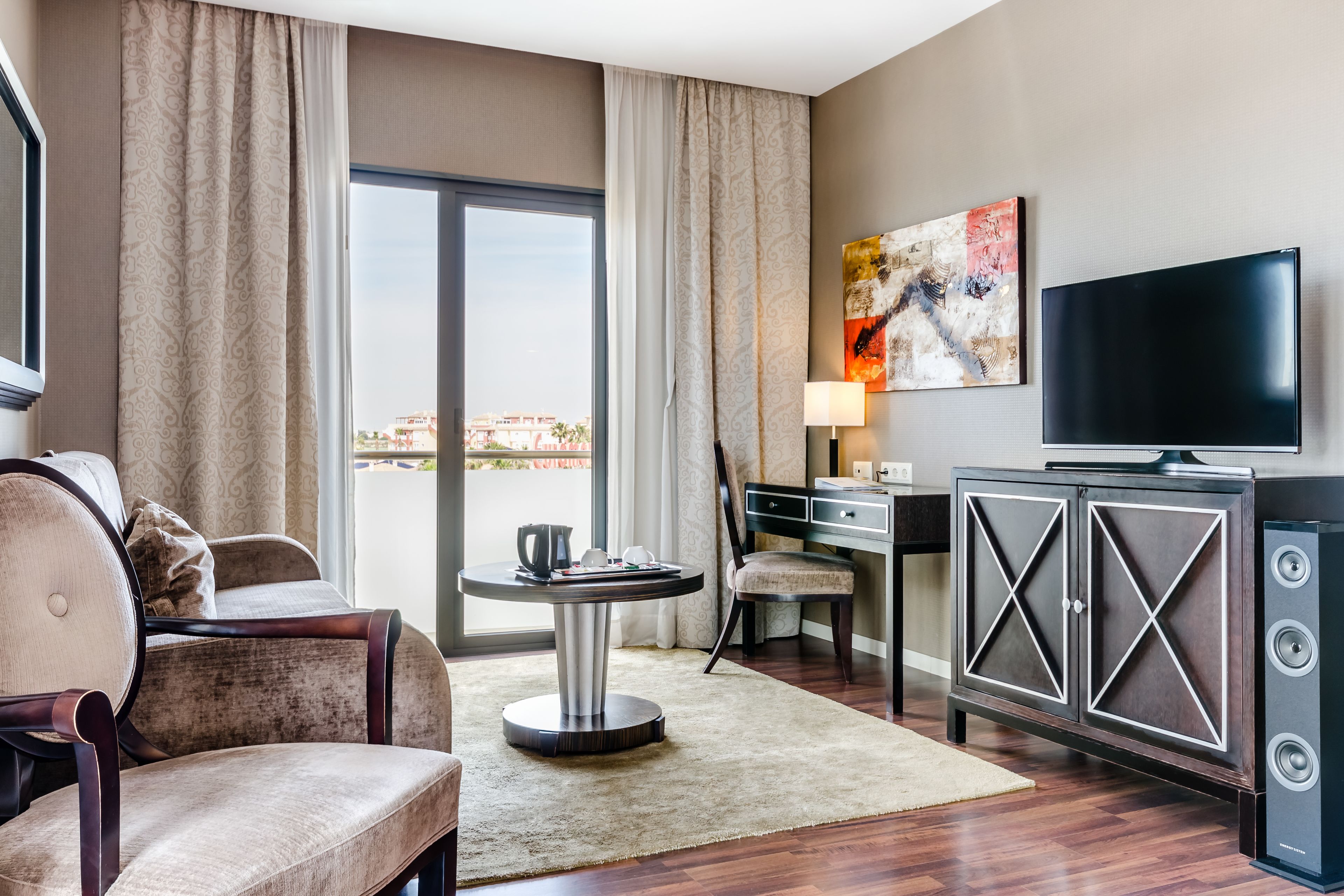 junior suite | living area | flat-screen tv