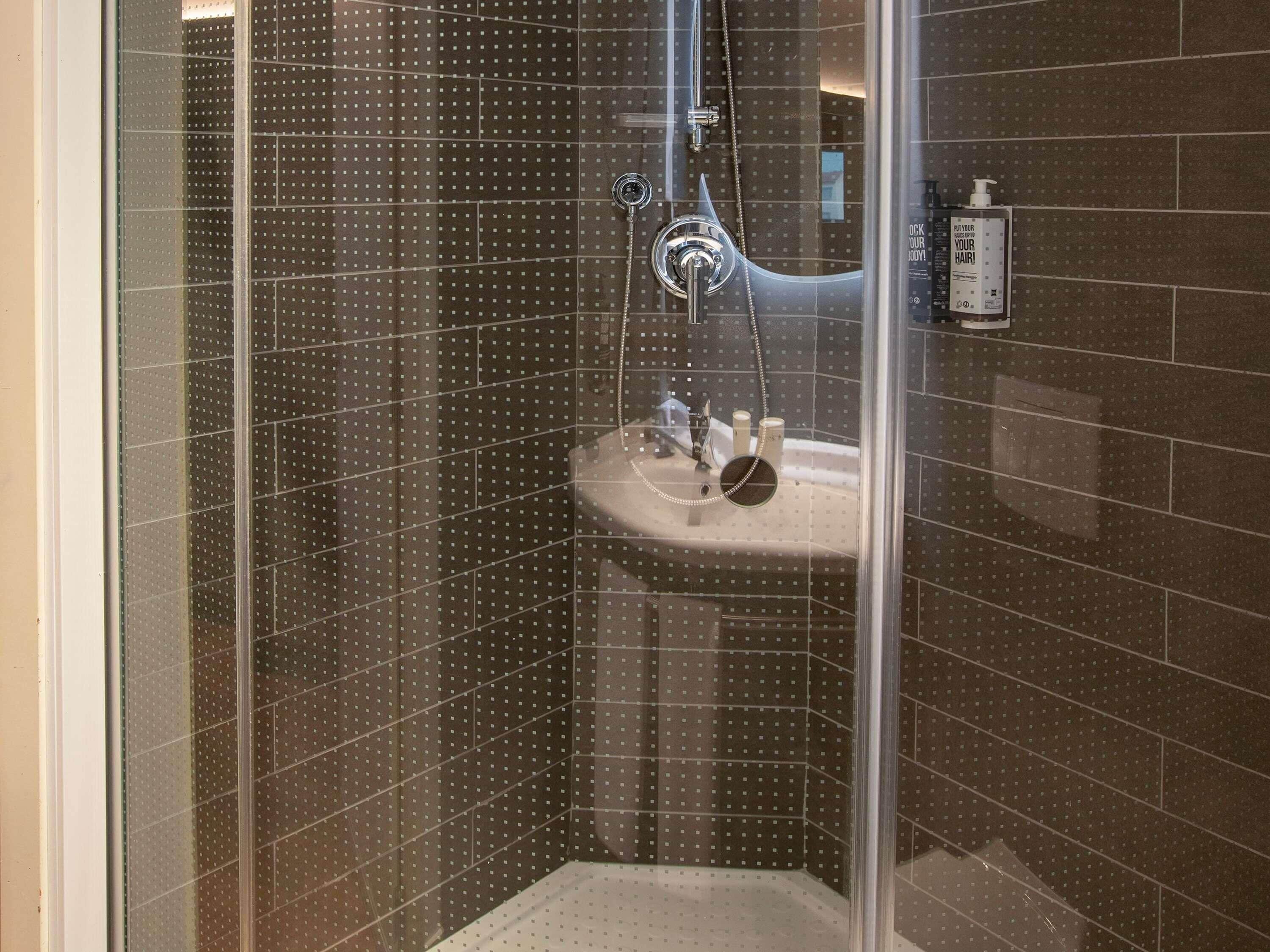 shower, eco-friendly toiletries, hair dryer, towels