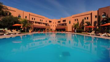 Outdoor pool, pool umbrellas, sun loungers
