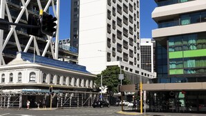 A modern urban building with a prominent glass facade and a series of balconies. - Auckland Harbour Suites (Auckland)