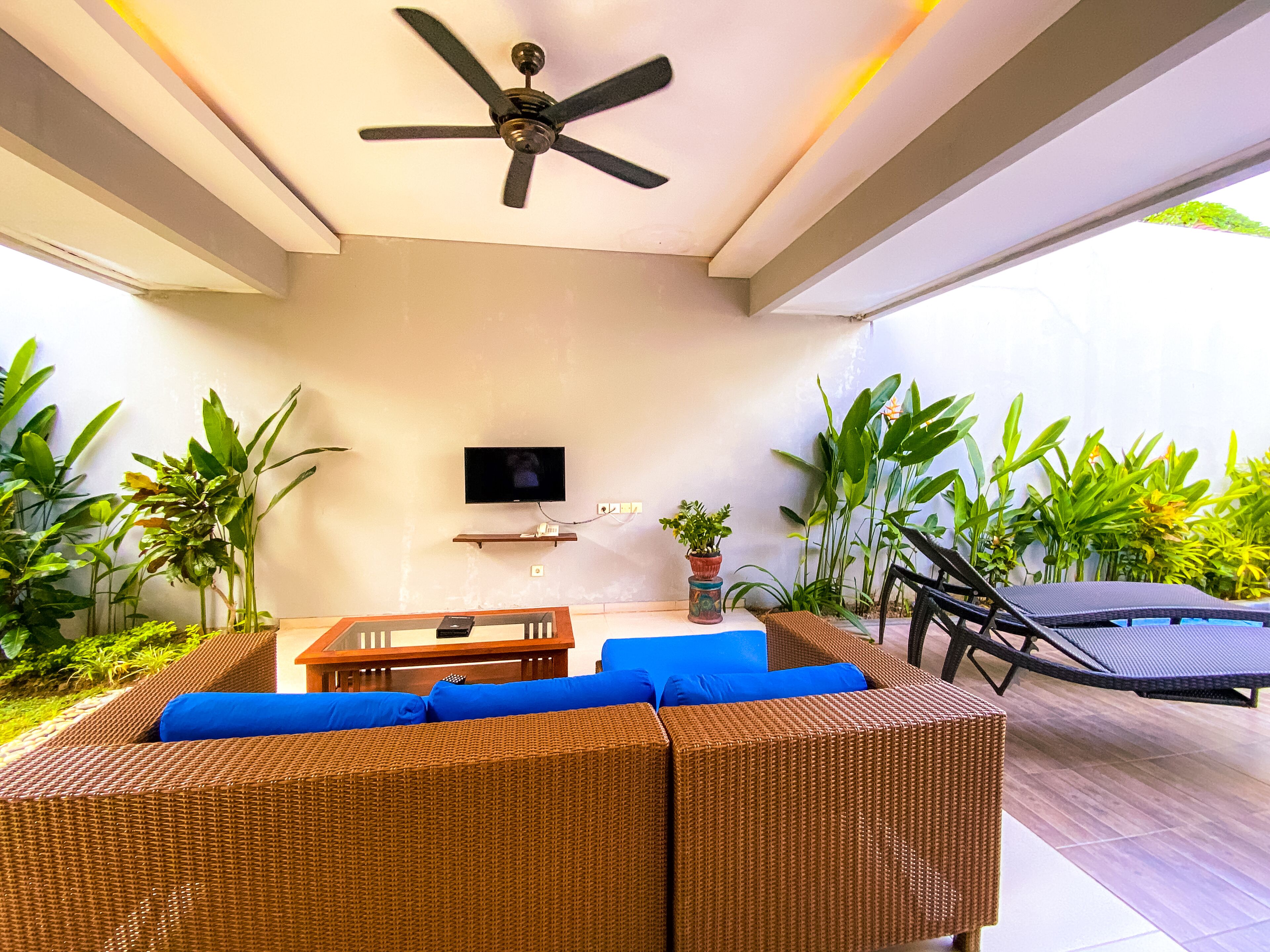 deluxe villa, private pool | living area | 32-inch led tv with satellite channels, tv