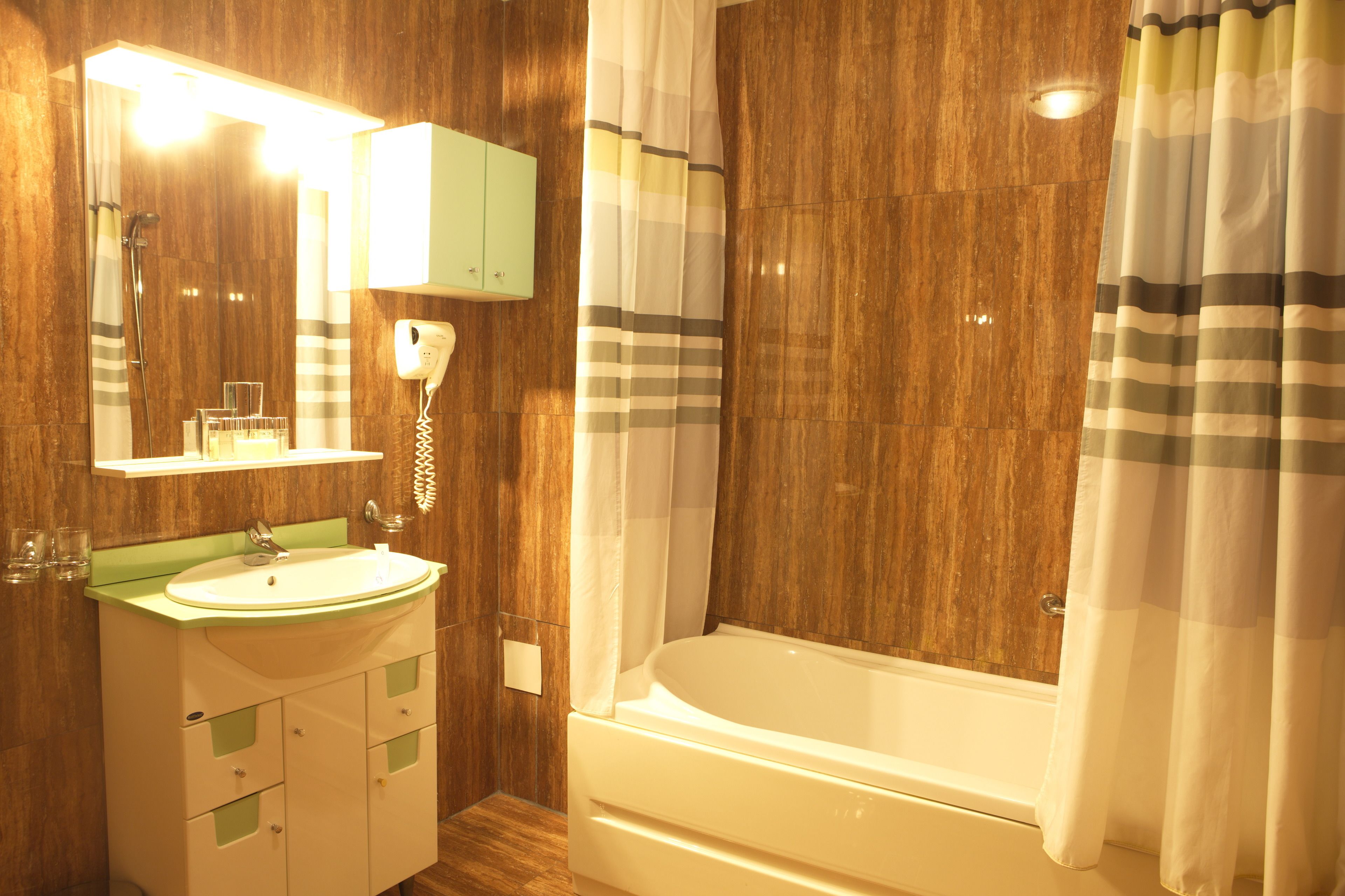 combined shower/bathtub, free toiletries, hair dryer, bathrobes