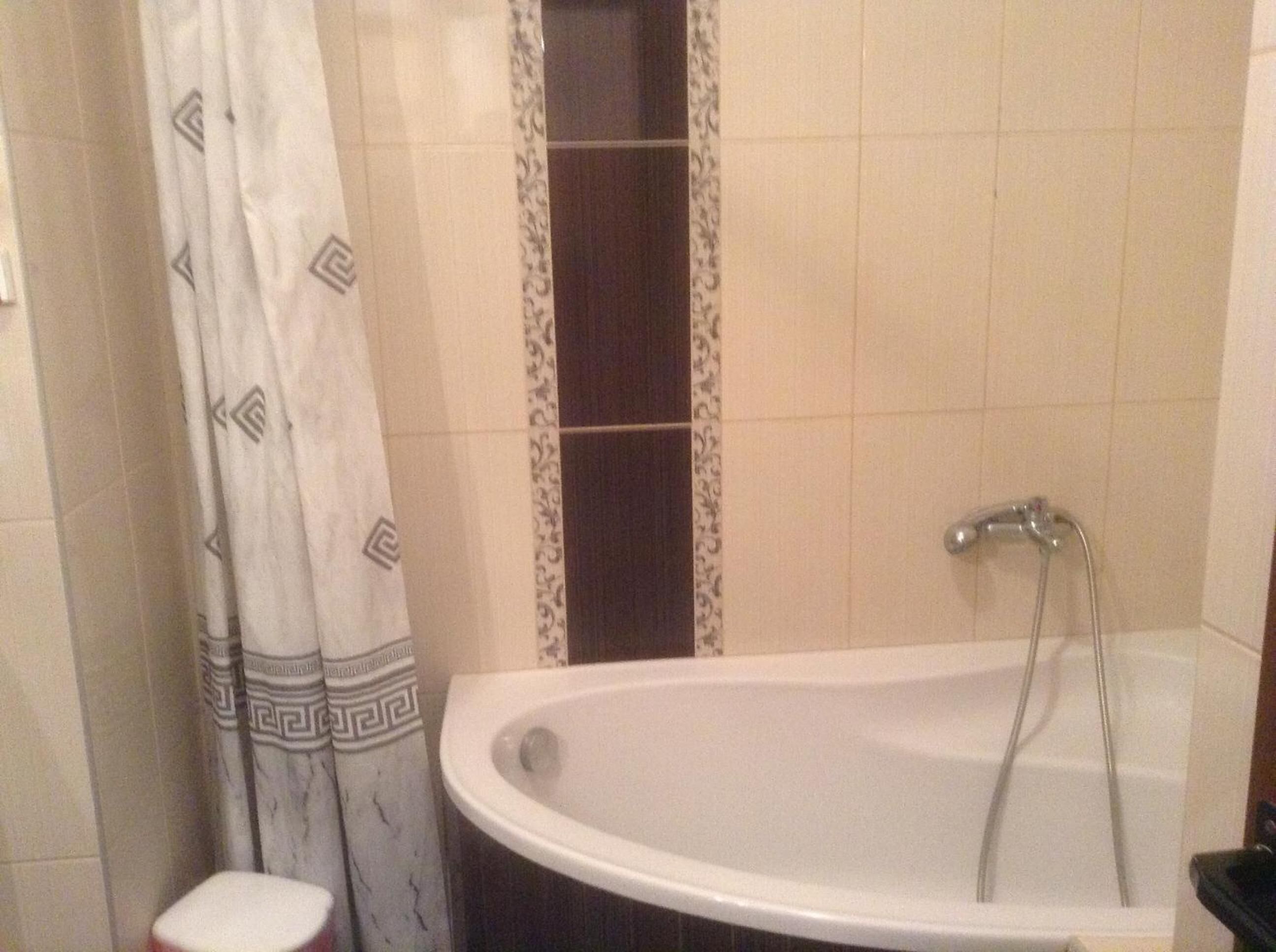 A bathroom with a bathtub, a shower, and a toilet.