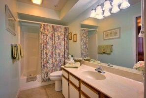 A bathroom with a bathtub, toilet, and sink. - Branson Condo Resorts by Andy Williams Theatre (Branson)