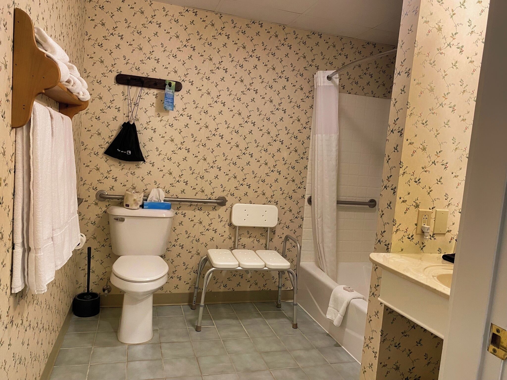 A bathroom with a toilet, a shower, and a bathtub.