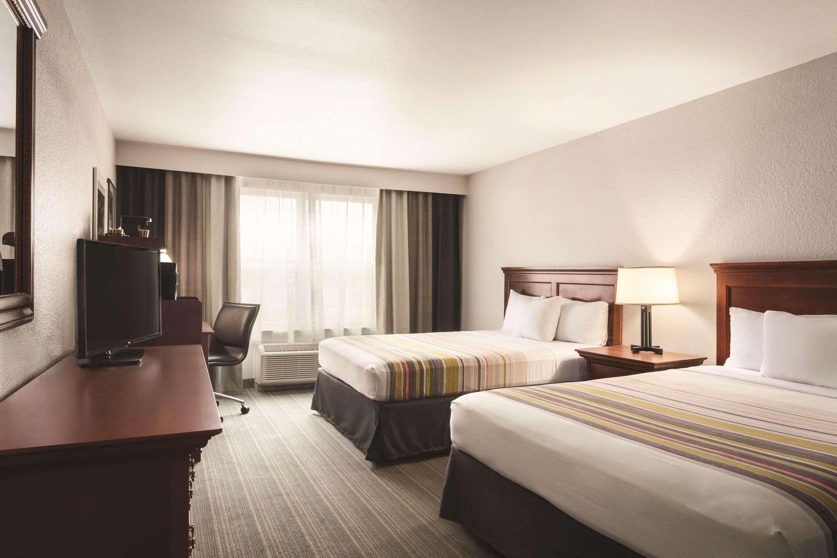 Down duvets, pillow-top beds, in-room safe, desk
