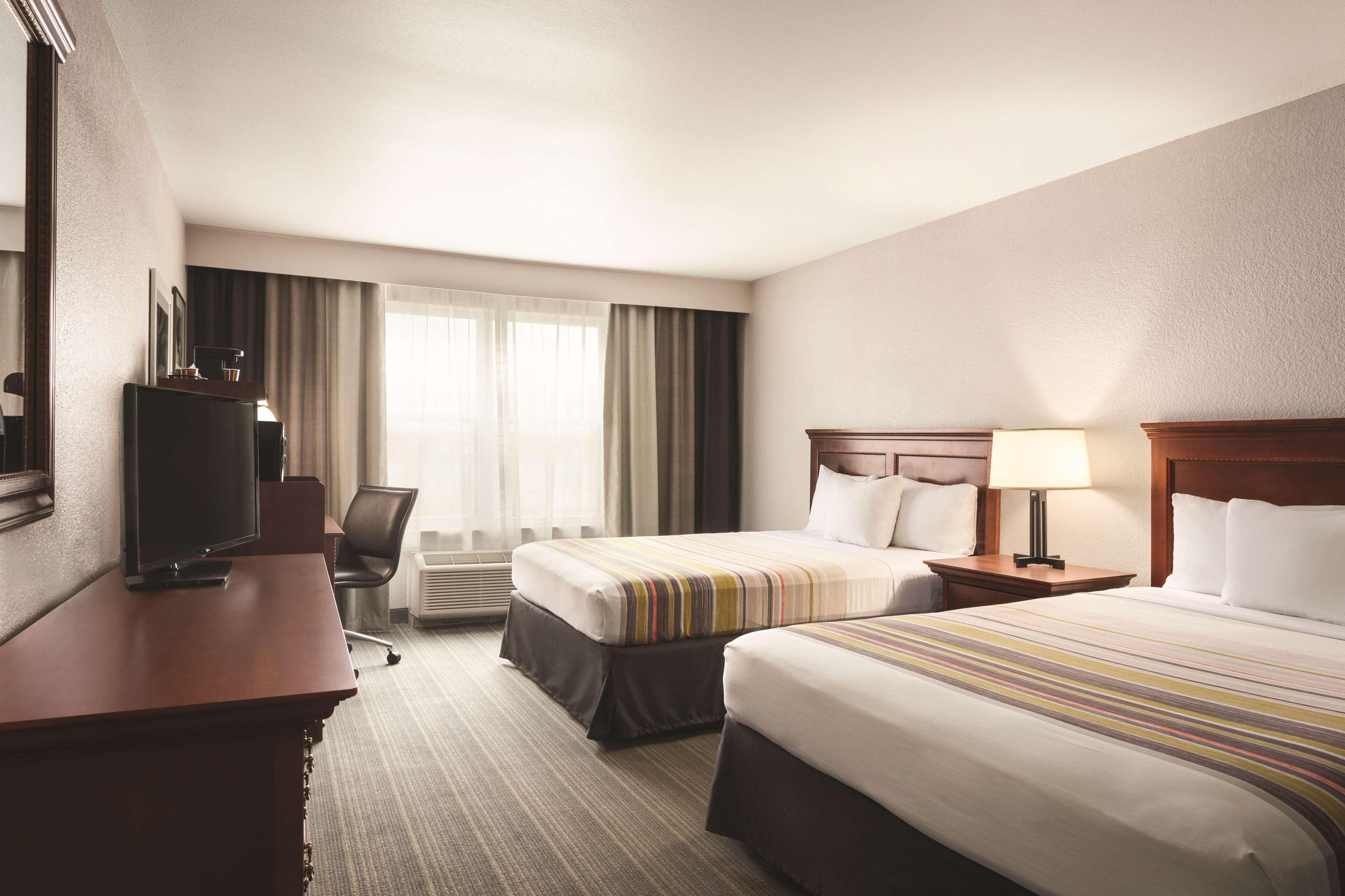 Down duvets, pillow-top beds, in-room safe, desk