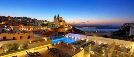 Indoor pool, 2 outdoor pools, open 8 AM to 8 PM, pool umbrellas