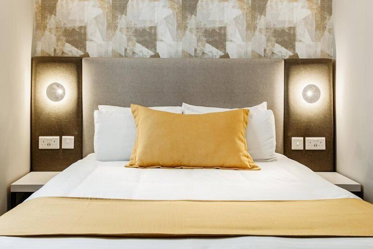 Standard Apartment, 1 Bedroom | Minibar, in-room safe, desk, blackout drapes