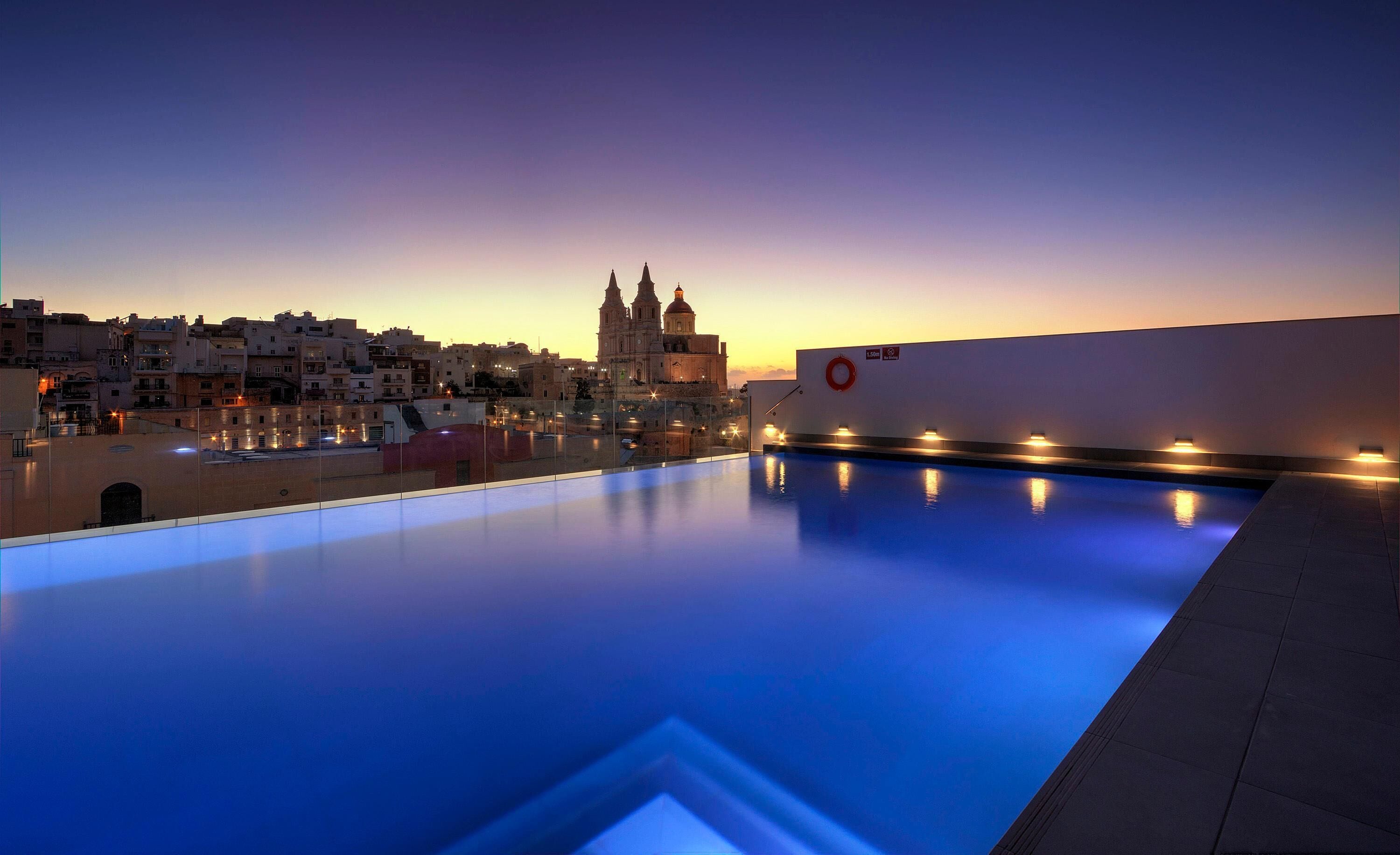 Indoor pool, 2 outdoor pools, open 8 AM to 8 PM, pool umbrellas