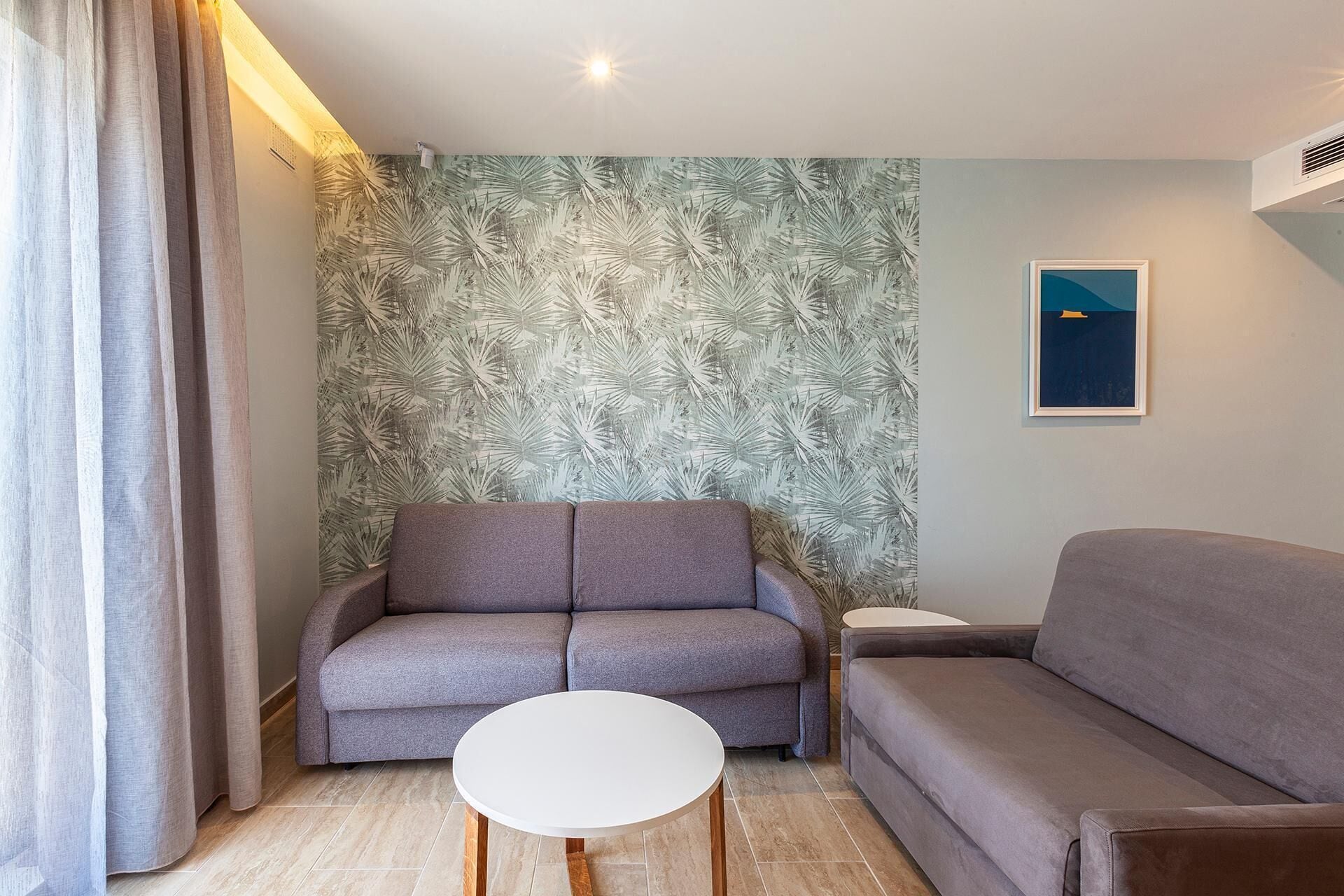 Apartment, 1 Bedroom, Balcony, Sea View | Minibar, in-room safe, desk, blackout drapes