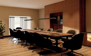 A modern conference room with a long table, multiple chairs, a potted plant, and a large window. - voco Guadalajara Expo by IHG (Guadalajara)
