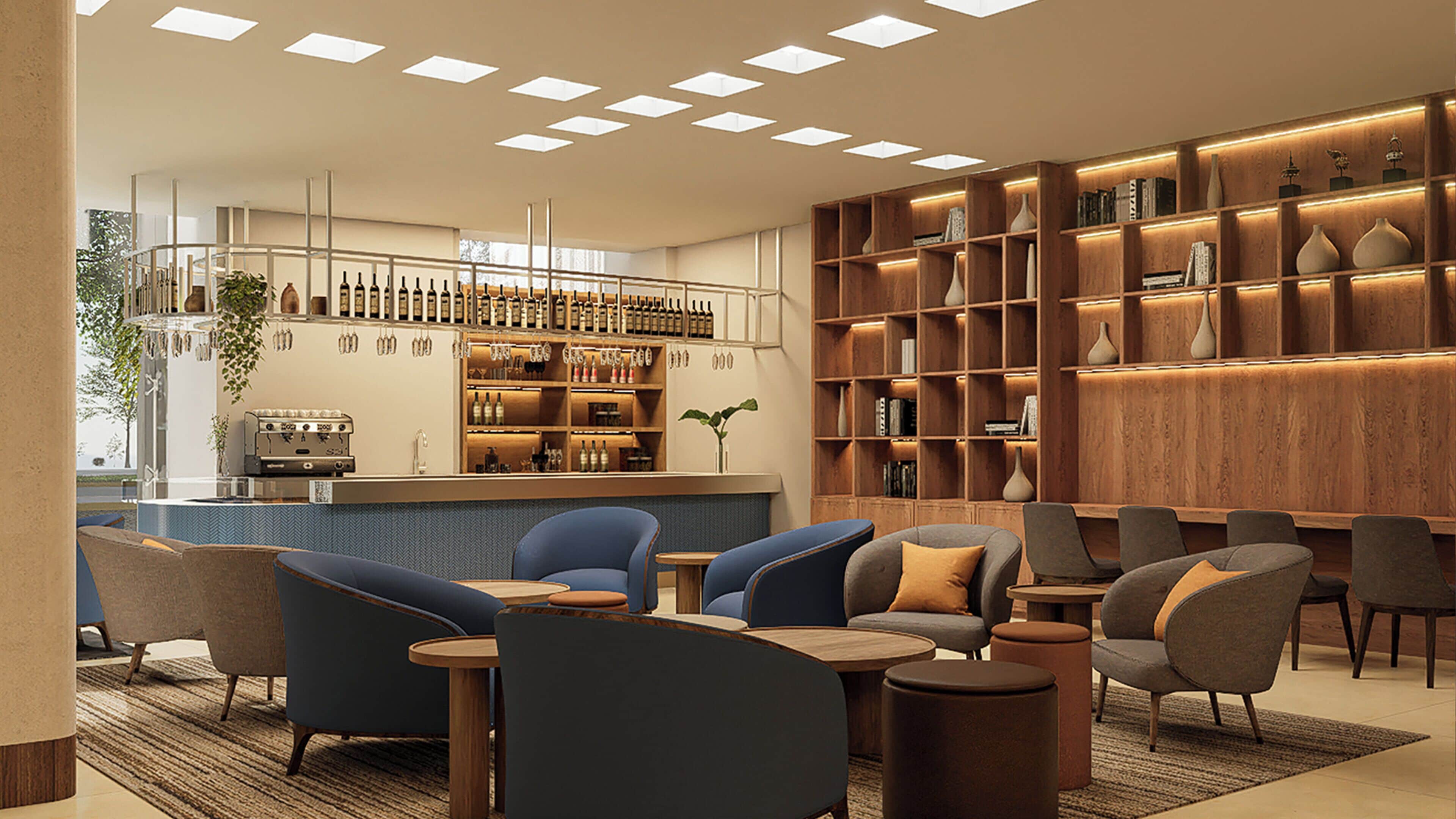 Un espace bar moderne avec des sièges et une bibliothèque.