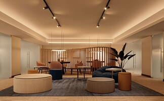 Un interior moderno con una zona de estar, una mesa de comedor y una planta decorativa.