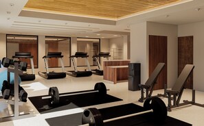 A modern gym with treadmills, weightlifting equipment, and a bench press. - voco Guadalajara Expo by IHG (Guadalajara)